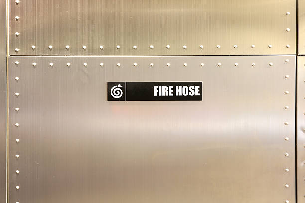 istock Fire hose label against metal wall 534668023