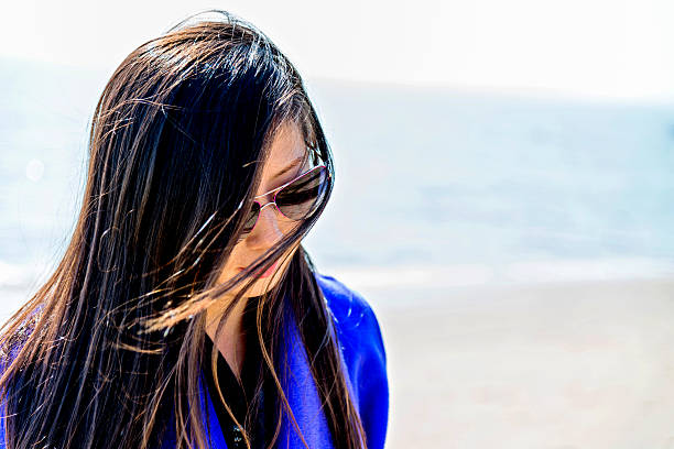 istock Young asian woman on beach 534669569