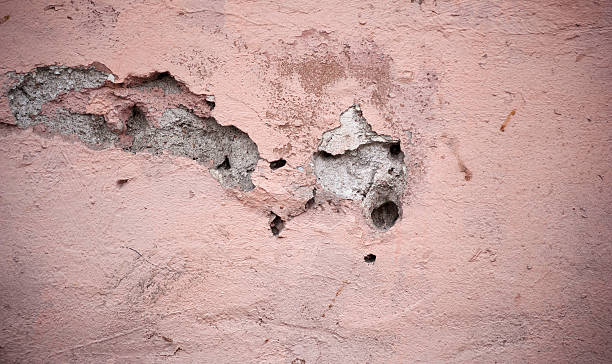 istock Texture of old wall covered with pink stucco 534669715