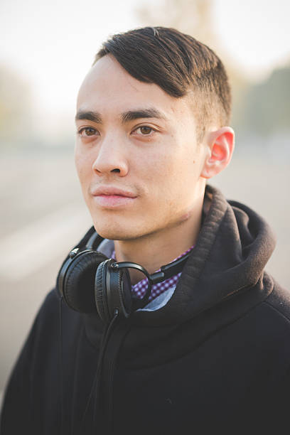 istock young crazy funny asian man in town 534669979