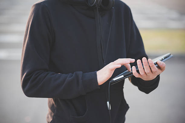istock close up of young man hand using tablet 534670083