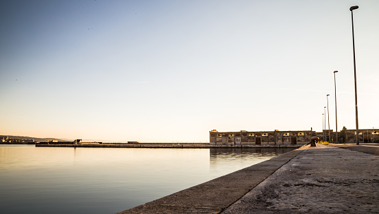a view of the abandoned Old Port of trieste in an autumn evening