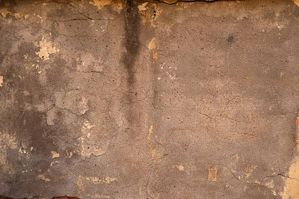 istock Texture of old wall covered with gray stucco 534670787