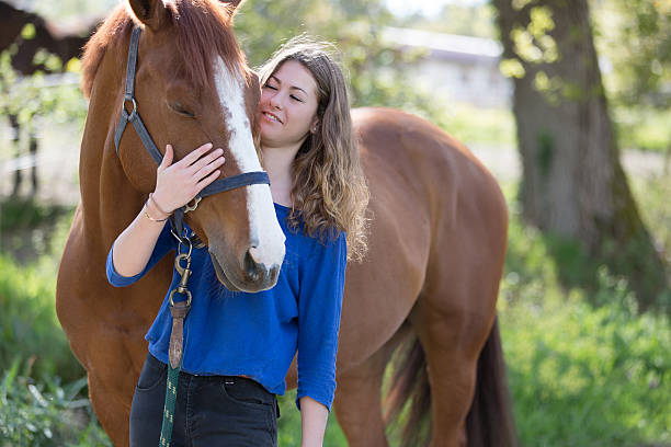 istock pretty girl with her horse 534671072