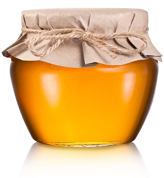 istock Glass can full of honey. 534678701