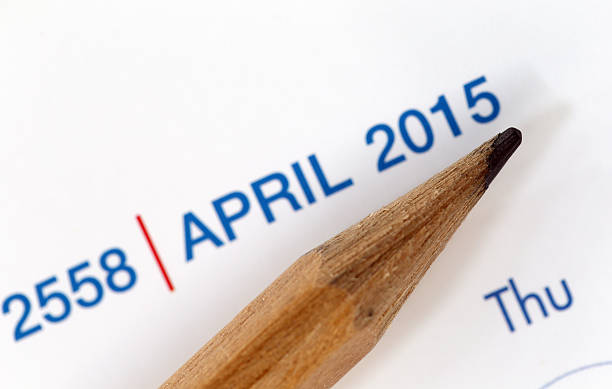 istock The tip of a pencil point to year blur Text. 534680041