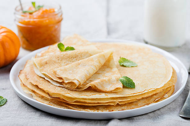 istock Thin crepes or pancakes with butter, honey and sour cream 534680916