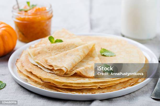 Thin Crepes Or Pancakes With Butter Honey And Sour Cream Stock Photo - Download Image Now