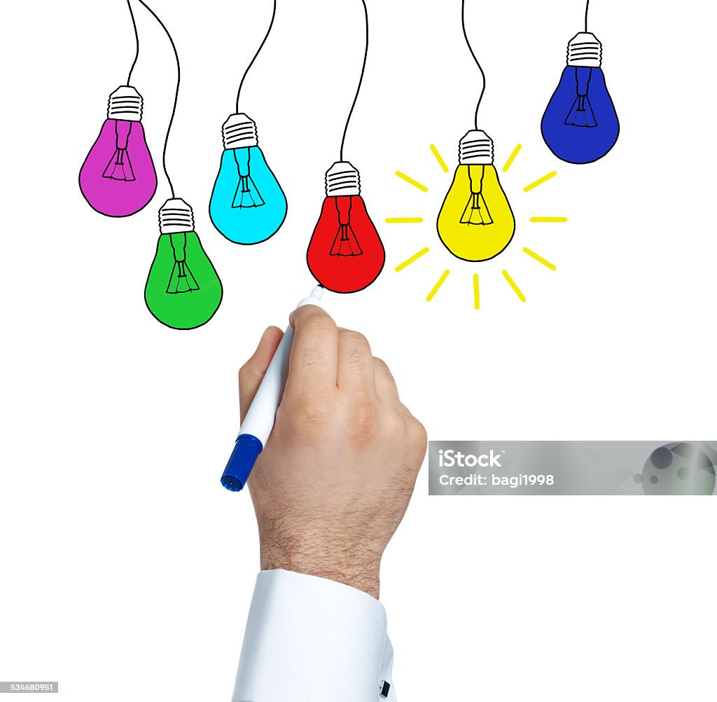 Solutions and ideas. Businessman drawing idea, lamp (Felt Tip Pen) 2015 Stock Photo