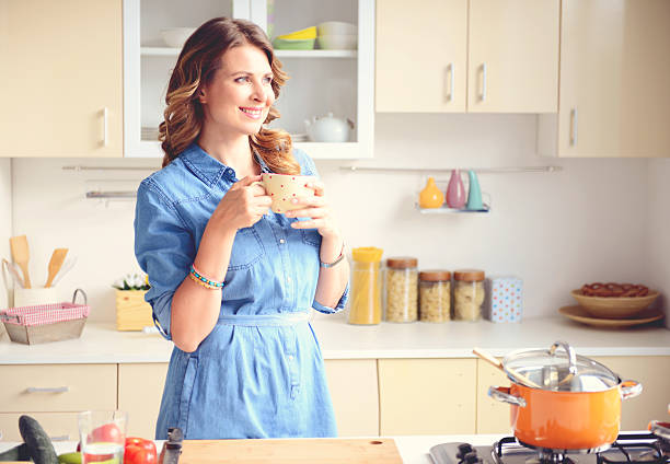 istock beautiful blonde woman in the modern kitchen 534681465