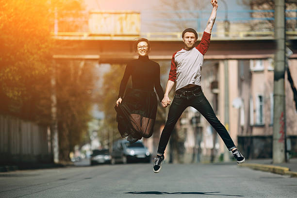 istock Beautiful young couple jumping 534688706