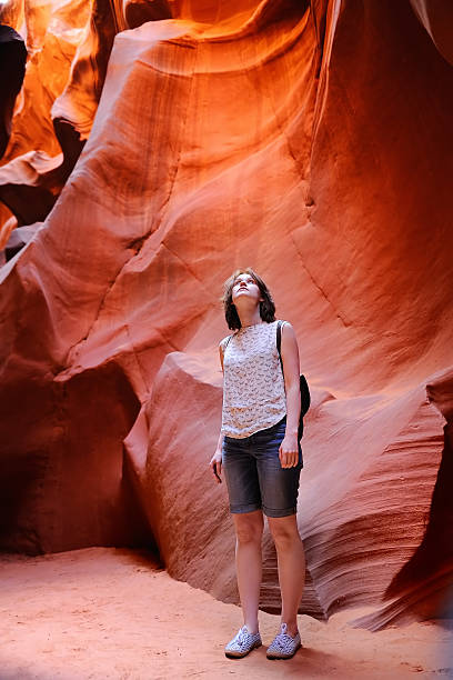 istock Delighted female tourist in Lower Antelope Canyon 534692400