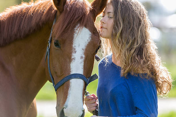 istock girl and horse 534692582