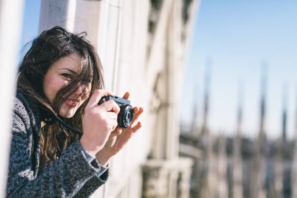 istock Woman with digital camera, Milan Cathedral, Italy 534697069