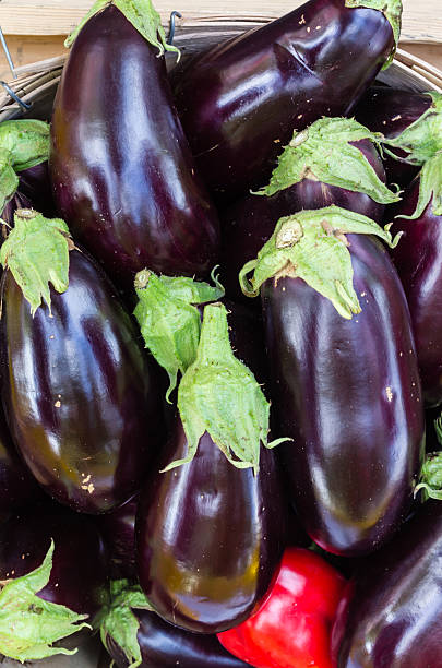 istock Eggplant in wooden baskets on display 534697551