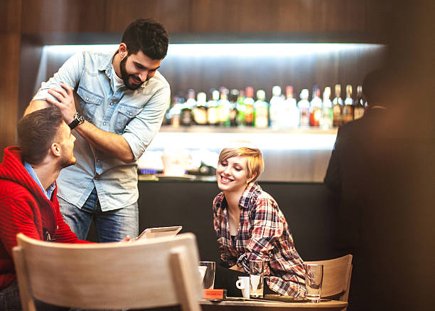 istock Teenage friends debating at coffee bar 534698187
