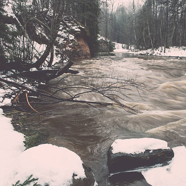 istock scenic winter colored river in country - vintage retro 534699347