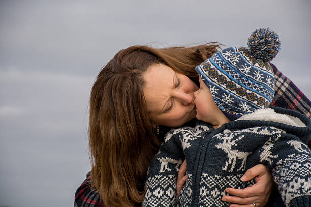 istock Mother kissing baby son 534700035