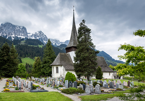 Landscape in the swiss alps featuring an old church