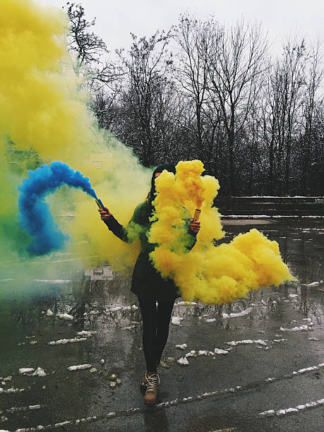 istock Girl holding smoke coloured bombs 534700681
