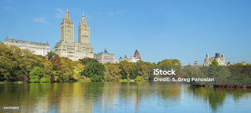 Central Park - New York Skyscrapers reflected in the lake at Central Park (New York City). 2015 Stock Photo