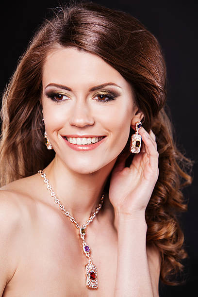 istock Beauty smiling model with perfect makeup and luxury accessories 534700957