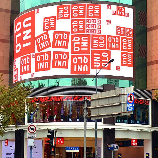 Shanghai, China - November 8, 2014: Uniqlo store on Huaihai Road in Shanghai China.  The Japanese company manufactures, designs and sells its clothing and is currently expanding around the world.