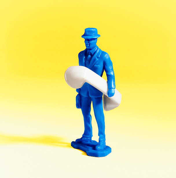 istock Blue Man Holding Telephone 534703107