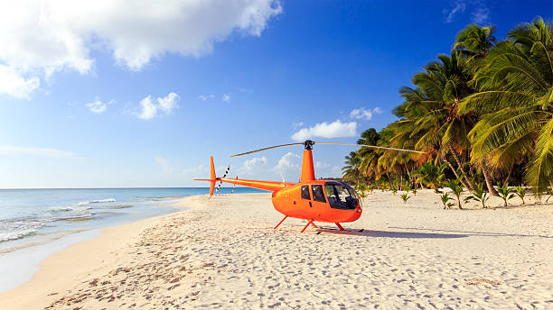 Helicopter on caribbean beach stock photo