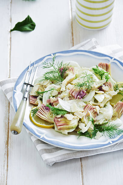 Fennel and artichoke salad with Parmesan cheese. Italian cuisine. stock photo