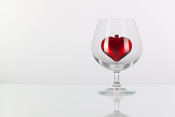 istock Red heart inside a glass of cognac 534705823