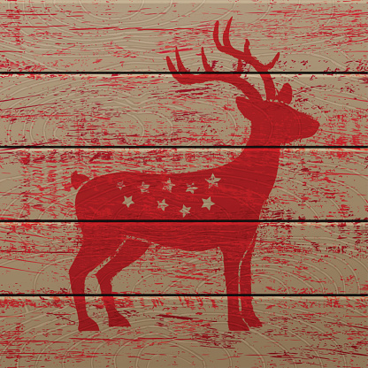 Reindeer on old wooden background