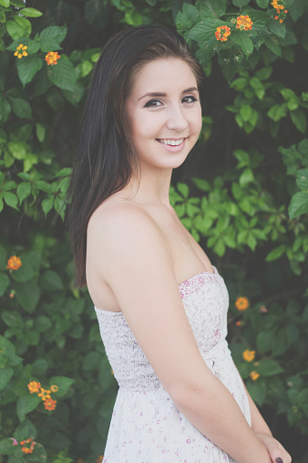 portrait of young brunette outdoors