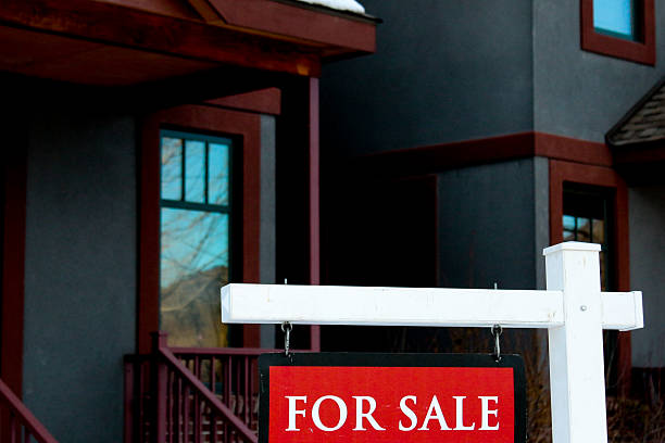 istock Condo for sale with a red sign on white pole 534716161