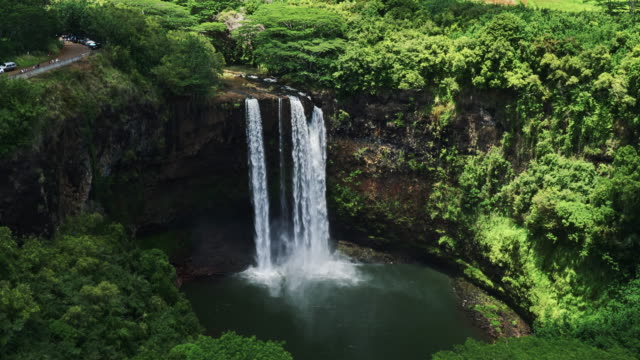 Aerial view of amazing waterfall in tropical rain forest jungle