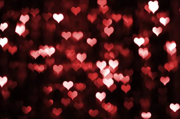 Photo of Abstract dark valentine background with red hearts