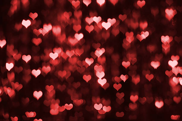 istock Abstract dark valentine background with red hearts 534736357