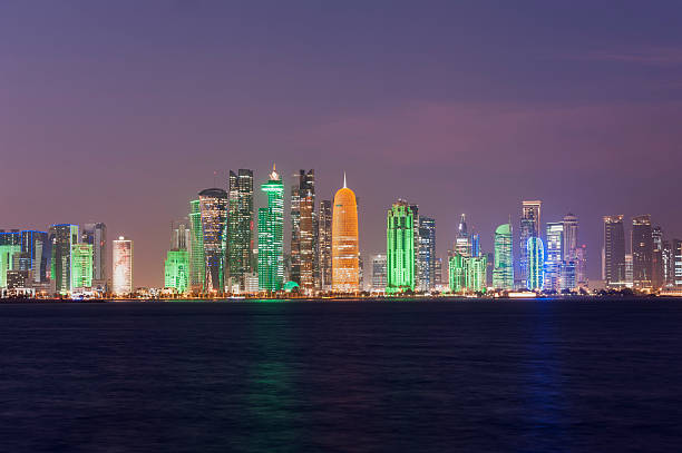 colorful photo of skyline of Doha, Qatar 2015 by night colorful photo of the skyline of Doha, Qatar 2015 by night collorful stock pictures, royalty-free photos & images