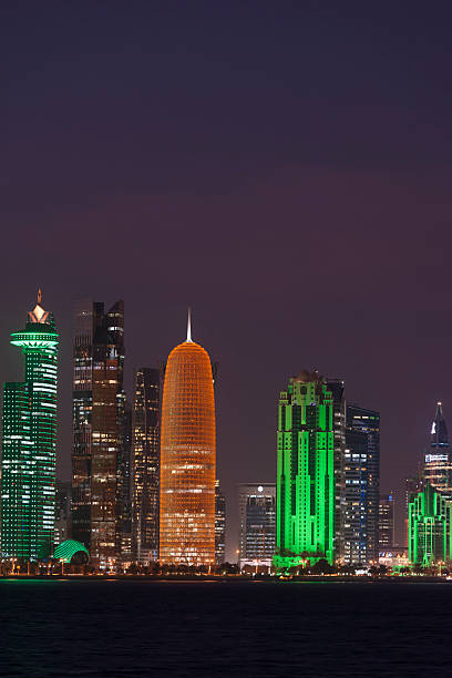 colorful photo of skyline of Doha, Qatar 2015 by night colorful photo of the skyline of Doha, Qatar 2015 by night collorful stock pictures, royalty-free photos & images