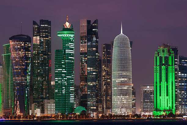 colorful photo of skyline of Doha, Qatar 2015 by night colorful photo of the skyline of Doha, Qatar 2015 by night collorful stock pictures, royalty-free photos & images