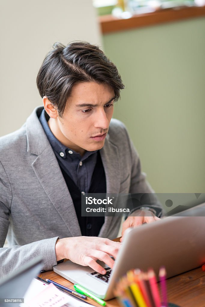 Young man working in startup coworking business office 20-29 Years Stock Photo