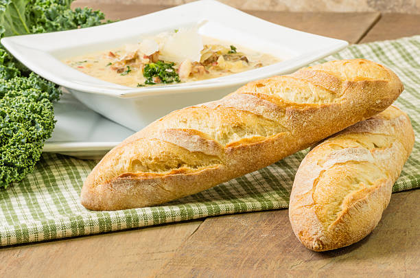 Loaves of bread with bowl of soup