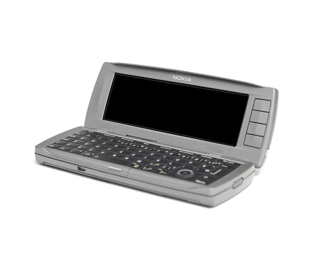 Bucharest, Romania - January 28, 2015: Nokia 9500 Communicator the smartphone that produced by Nokia, introduced on February 24, 2004 and released in November 2004. It runs on the Symbian-based Series 90 platform, albeit disguised to look like the Series 80 platform.
