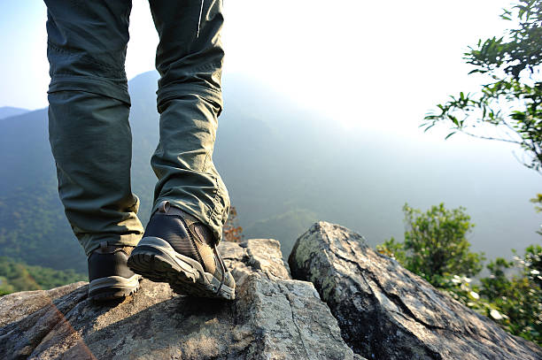 istock hiking legs  mountain peak rock 534741963