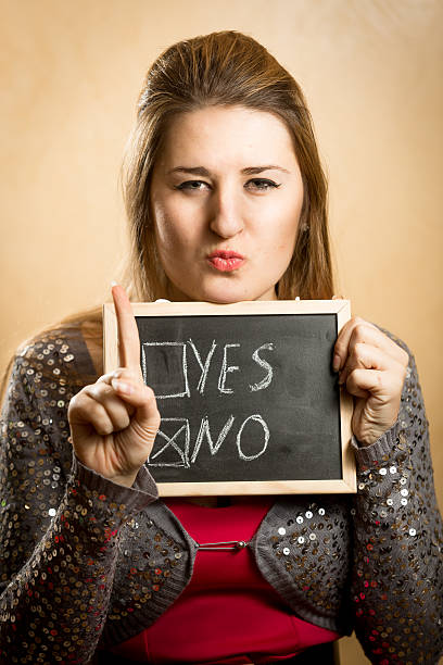 istock young woman showing checked box with answer 