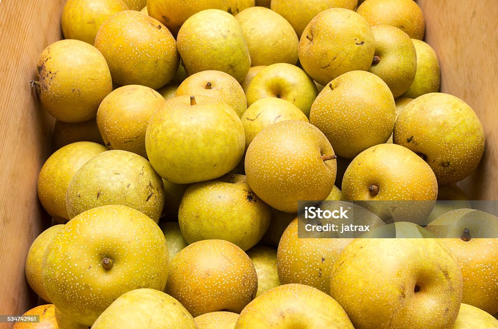 Wooden box of Kosui Asian pears Wooden box of fresh Kosui Asian pears on display Asian Pear Stock Photo