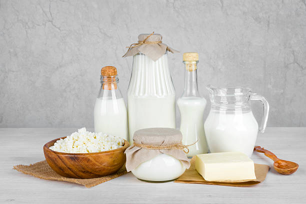 istock Dairy products on wooden table over vintage abstract background 534742987