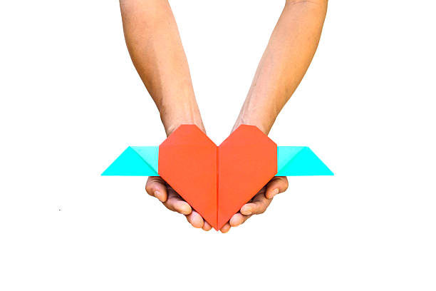 istock Hand with red heart shape paper 534755435