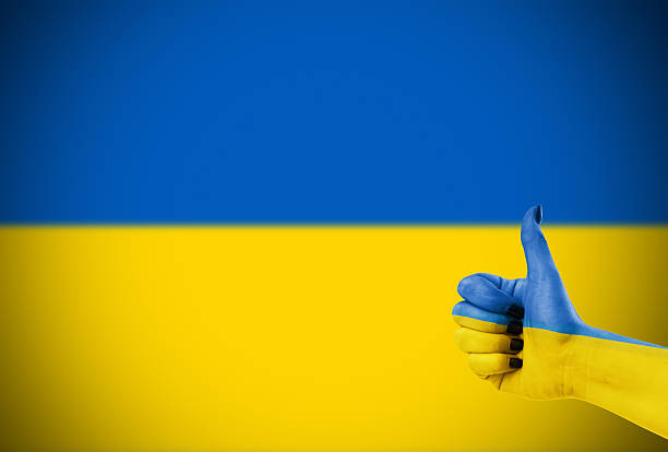 Hand with thumb down gesture in colored sweden national flag as symbol of negative political, cultural, social management of country