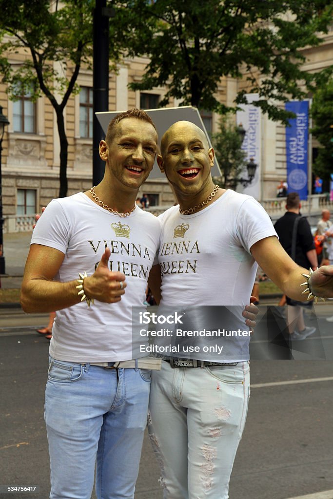 Queens Vienna, Austria - June 14, 2014: A pair of men marching at the Gay Pride Parade in Vienna. 2015 Stock Photo